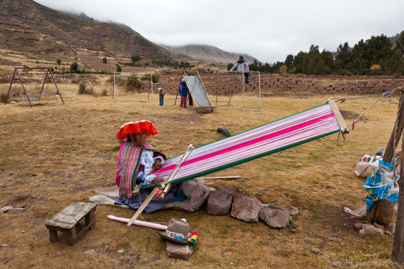 A woman weaving a blanket, Sacred Valley A woman weaving a blanket, Sacred Valley